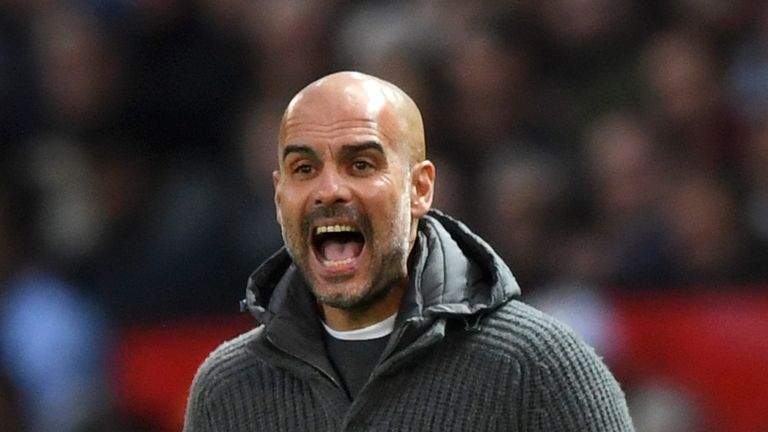 Pep Guardiola reacts on the touchline at Old Trafford