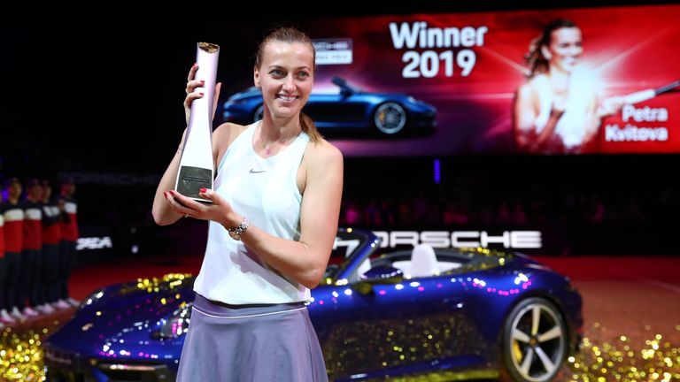 Petra Kvitova of Czech Republic celebrates with the trophy in front of the Porsche Carrera 4S after winning the final match against Anett Kontaveit of Estonia on day 7 of the Porsche Tennis Grand Prix at Porsche-Arena on April 28, 2019 in Stuttgart, Germany. 
