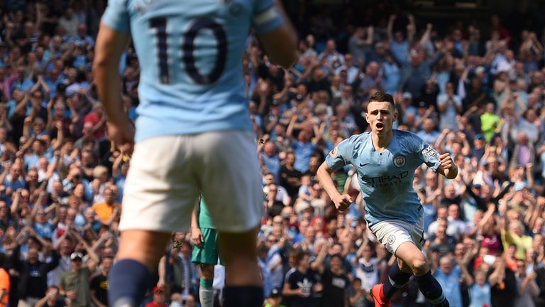 Phil Foden celebrates after scoring the opening goal of the game