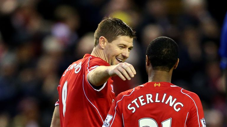 Steven Gerrard of Liverpool celebrateswith teammate Raheem Sterling of Liverpool after scoring his team's second goal from the penalty spot during the Barclays Premier League match between Liverpool and Leicester City at Anfield on January 1, 2015 in Liverpool, England.