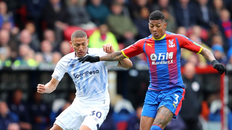 Richarlison and Patrick Van Aanholt compete for possession