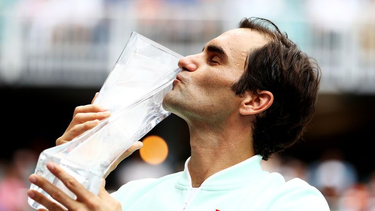 Roger Federer of Switzerland poses with the winners trophy after defeating John Isner in straight sets during the Men's Final match on day 14 of the Miami Open presented by Itau at Hard Rock Stadium on March 31, 2019 in Miami Gardens, Florida