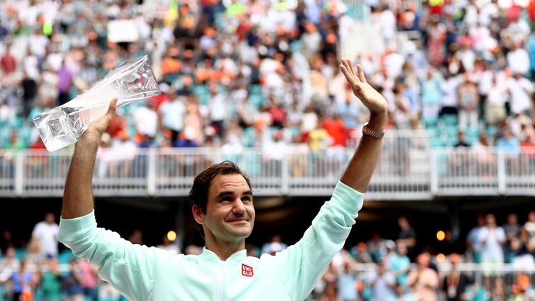 Roger Federer of Switzerland poses with the winners trophy after defeating John Isner in straight sets during the Men's Final match on day 14 of the Miami Open presented by Itau at Hard Rock Stadium on March 31, 2019 in Miami Gardens, Florida