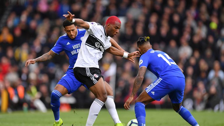 Ryan Babel of Fulham battles for possession with Nathaniel Mendez-Laing and Leandro Bacuna of Cardiff City