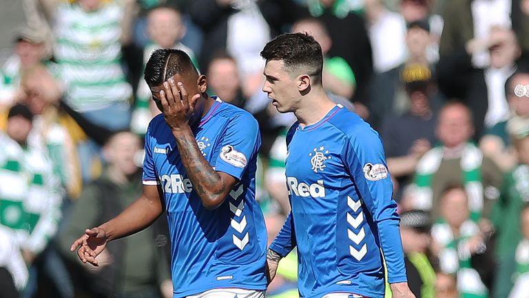 Alfredo Morelos is consoled by Ryan Jack after his red card against Celtic
