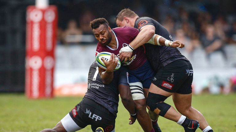 Sharks' Tendai Mtawarira and Coenie Oosthuizen try to stop Samu Kerevi