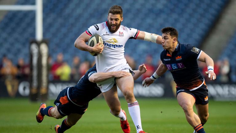  Stuart McCloskey of Ulster is tackled by Mark Bennett and Damien Hoyland (right) of Edinburgh 