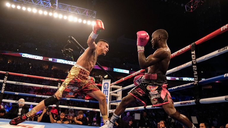 OMAHA, NE - OCTOBER 13:Jose Benavidez (red/yellow trunks) and Bud Crawford (black/pink trunks) exchange blows during their match at at CHI Health Center on October 13, 2018 in Omaha, Nebraska. Crawford won via TKO in the 12th round.. (Photo by Eric Francis/Getty Images)