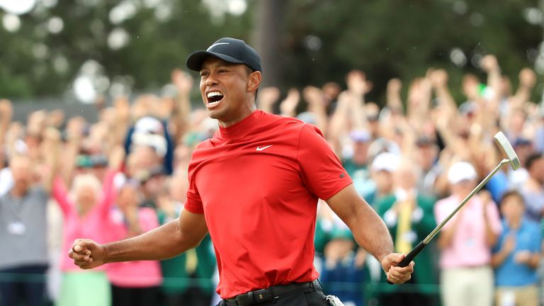 AUGUSTA, GEORGIA - APRIL 14: Tiger Woods of the United States celebrates after sinking his putt to win during the final round of the Masters at Augusta National Golf Club on April 14, 2019 in Augusta, Georgia. (Photo by Andrew Redington/Getty Images)