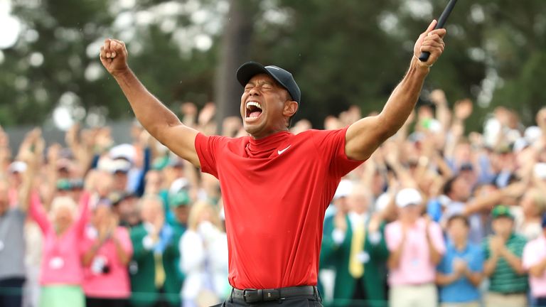 Tiger Woods celebrates after sinking his putt to win The Masters 2019