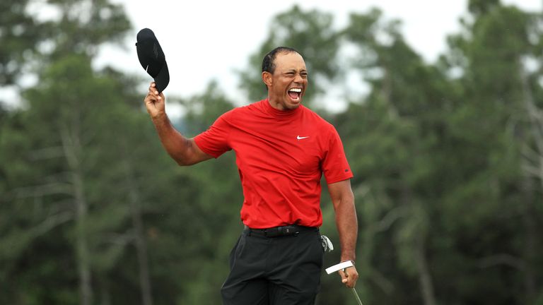 Tiger Woods celebrates after sinking his putt to win The Masters 2019