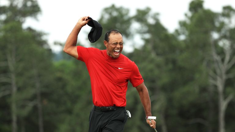 Tiger Woods celebrates after sinking his putt to win The Masters 2019