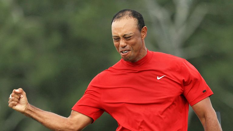 Tiger Woods celebrates after sinking his putt to win The Masters 2019