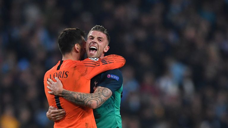 Toby Alderweireld and Hugo Lloris celebrate at the final whistle at the Etihad