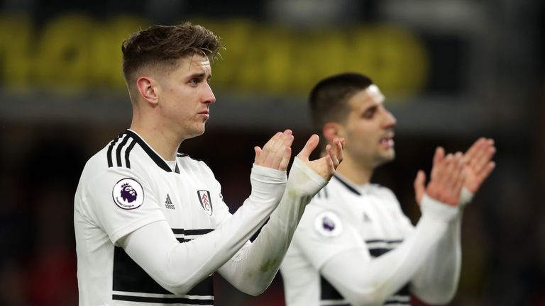 Tom Cairney applauds the travelling fans after another heavy away loss
