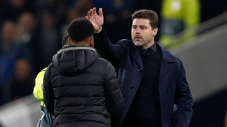 Tottenham manage Mauricio Pochettino confronts a pitch invader on Tuesday evening