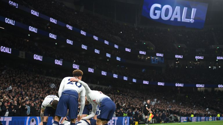 Tottenham's players celebrate the first goal in their new stadium