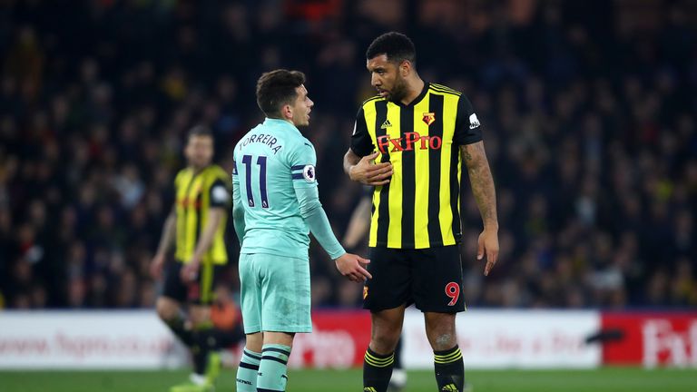 Troy Deeney confronts  Lucas Torreira after being shown a red card