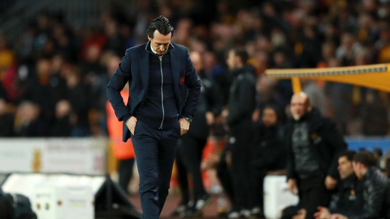 Unai Emery appears in contemplative mood as he walks along the touchline at Molineux