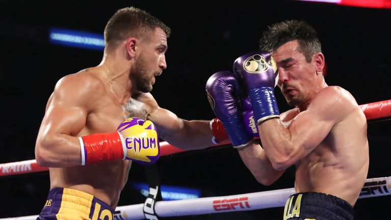 April 12, 2019;  Los Angeles, CA;  WBO/WBA champion Vasily Lomachenko and Anthony Crolla during their heavyweight title fight at the Staples Center in Los Angeles, CA.  Mandatory Credit: Ed Mulholland/ Matchroom Boxing