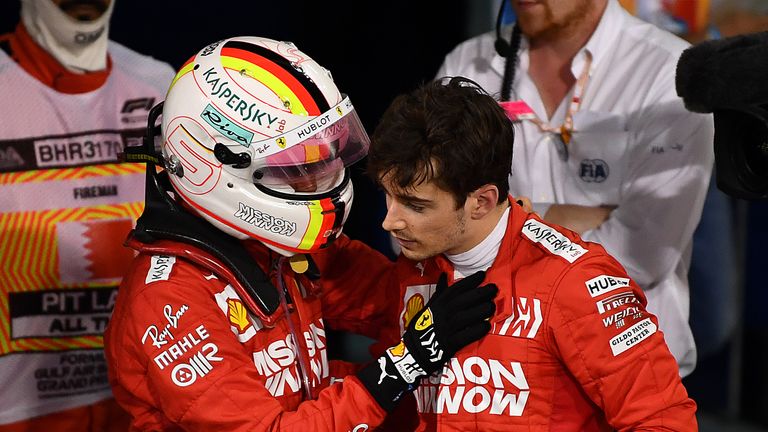 Sebastian Vettel of Germany and Ferrari consoles third placed finisher Charles Leclerc of Monaco and Ferrari in parc ferme during the F1 Grand Prix of Bahrain