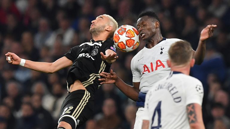 Victor Wanyama competes with Hakim Ziyech during the Champions League semi-final