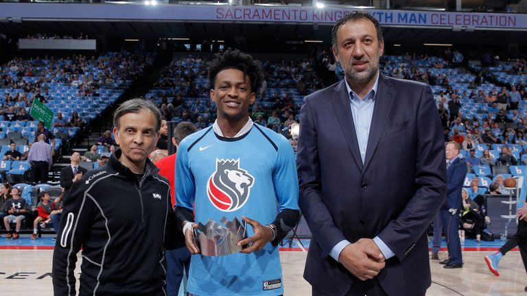 Owner Vivek Ranadive, De'Aaron Fox #5, and General Manager Vlade Divac of the Sacramento Kings pose a for photo after Vlade Divac is inducted into Hall of Fame during the game against the New Orleans Pelicans on April 7, 2019 at Golden 1 Center in Sacramento, California.