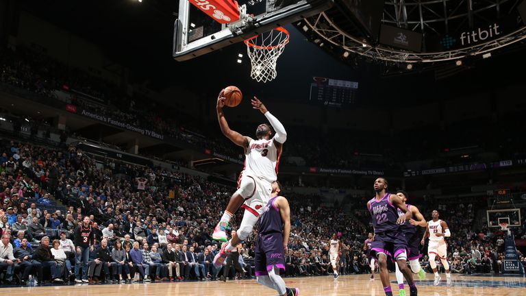 Dwyane Wade of the Miami Heat shoots the ball against the Minnesota Timberwolves