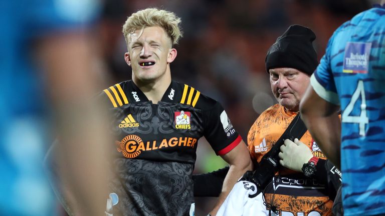 Damian McKenzie leaves the field after being injured playing for the Chiefs against the Blues 