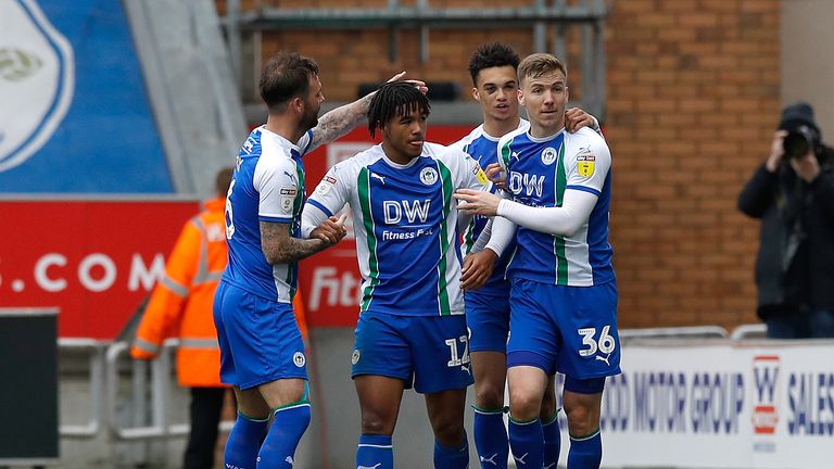 Reece James celebrates scoring Wigan's first goal with team-mates