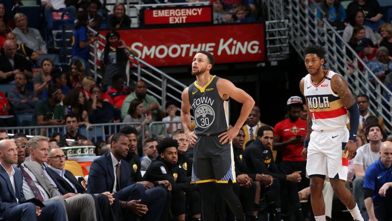 Stephen Curry heads to the bench against New Orleans