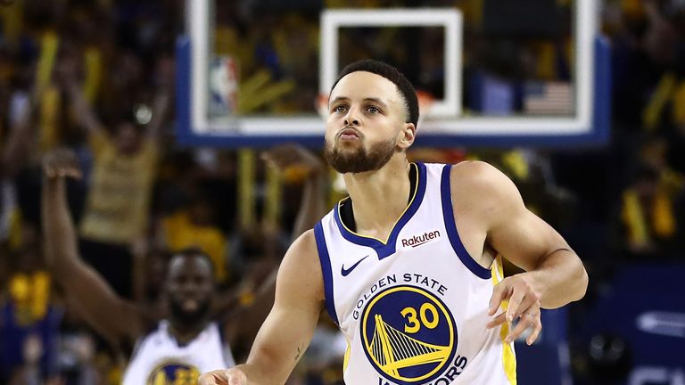Stephen Curry shimmies in celebration after making a three-pointer