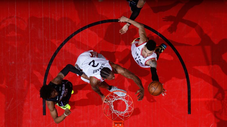 Kawhi Leonard and Danny Green secure possession for Toronto in Game 2 against the Magic