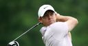 McIlroy five back from Dufner