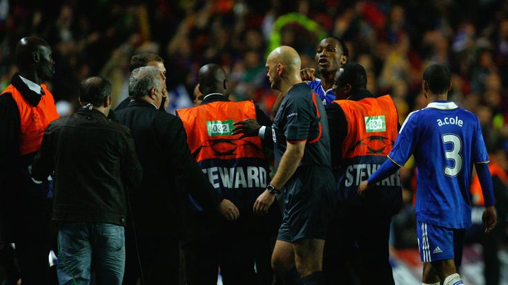 Drogba vents his fury at the Norwegian match official as he makes his way off the pitch