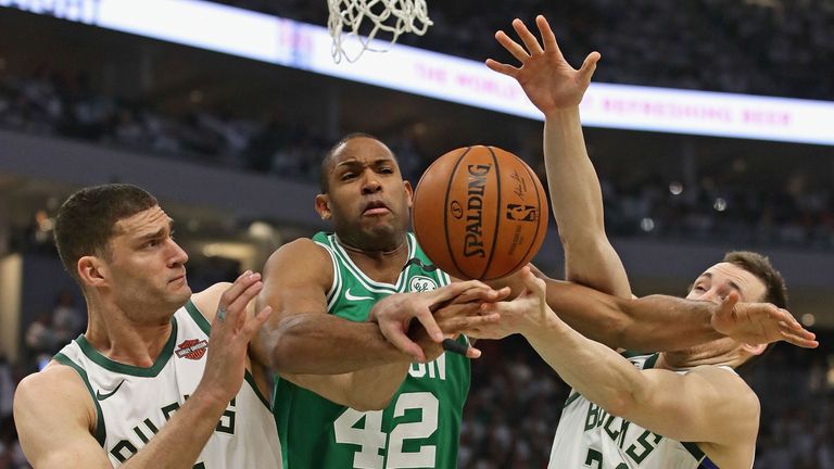 Al Horford is smothered by the Milwaukee Bucks defense in Game 2