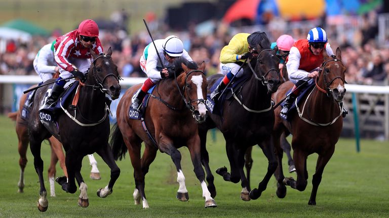 Baghdad, ridden by Silvestre De Sousa (left), wins the Qatar Racing Handicap 
