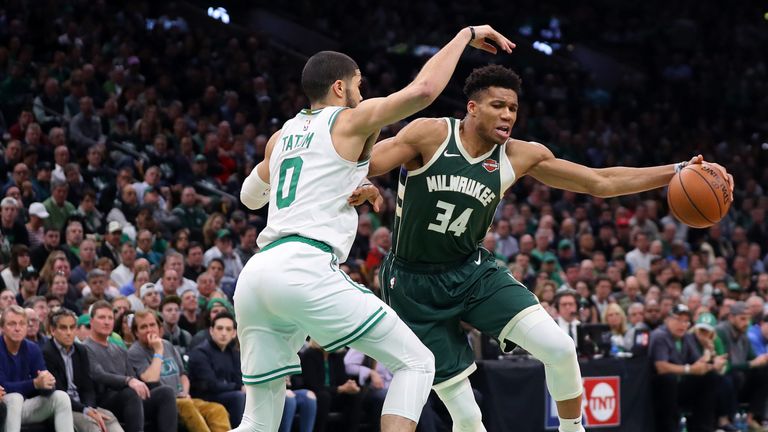 Jayson Tatum guards Giannis Antetokounmpo in Game 4