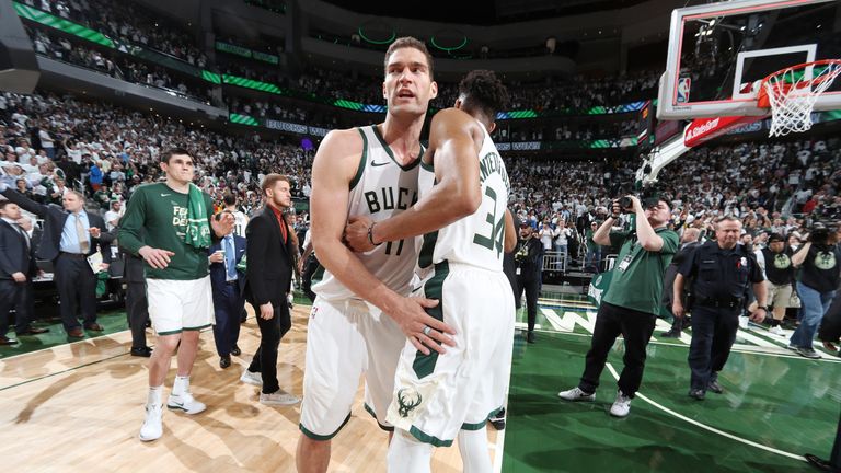 Brook Lopez is embraced by Giannis Antetokounmpo after Milwaukee's Game 1 win over Toronto