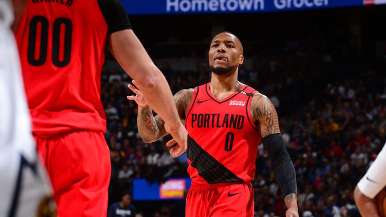 Damian Lillard celebrates a strong Blazers play with Enes Kanter