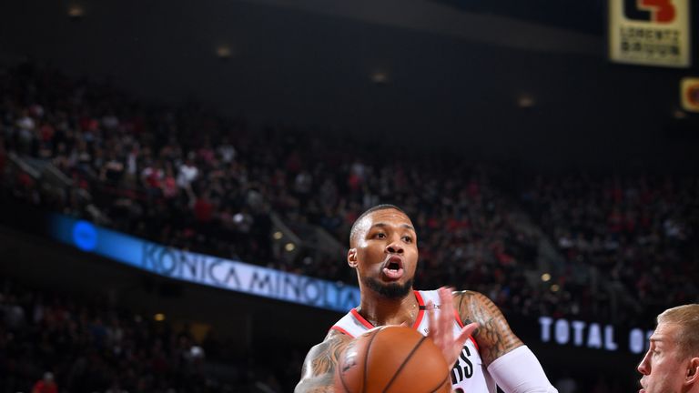 Damian Lillard whips an airborne pass in Portland's Game 6 win over Denver