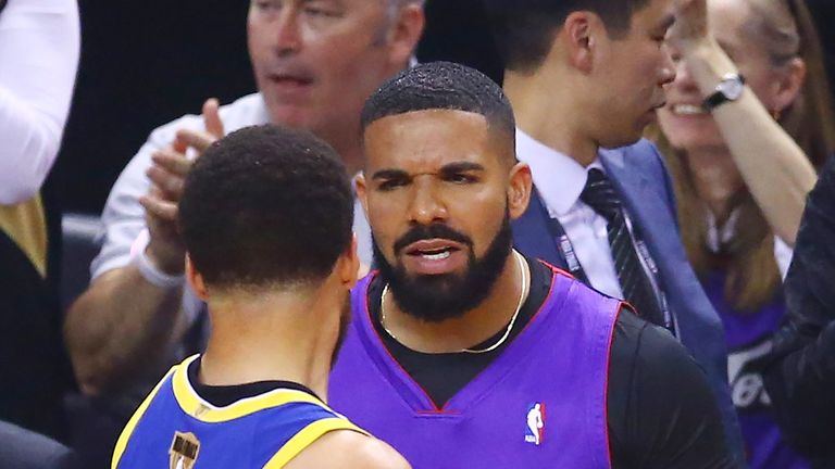 Drake and Stephen Curry exchange words during Game 1 of the NBA Finals