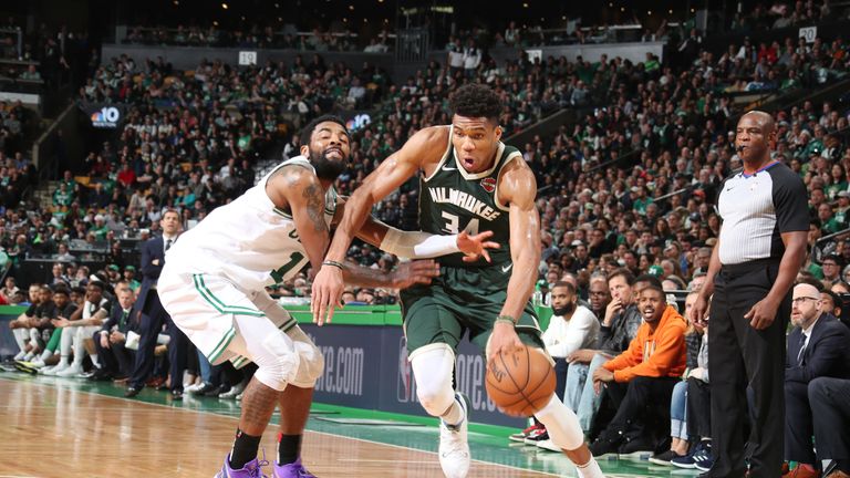 Giannis Antetokounmpo drives by Kyrie Irving in the Bucks&#39; Game 3 win over the Celtics