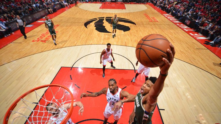 Giannis Antetokoumpo throws down a left-handed slam in Game 4 of the Eastern Conference Finals.