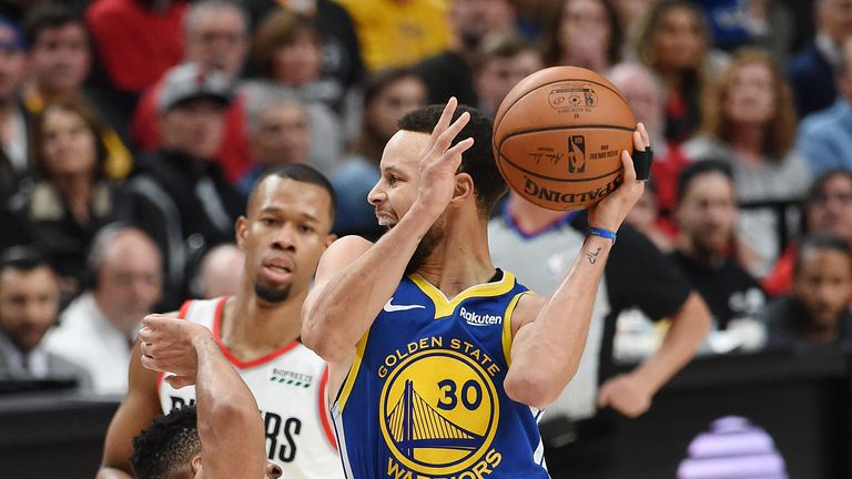 Stephen Curry absorbs contact from CJ McCollum in Game 4 of the Western Conference Finals