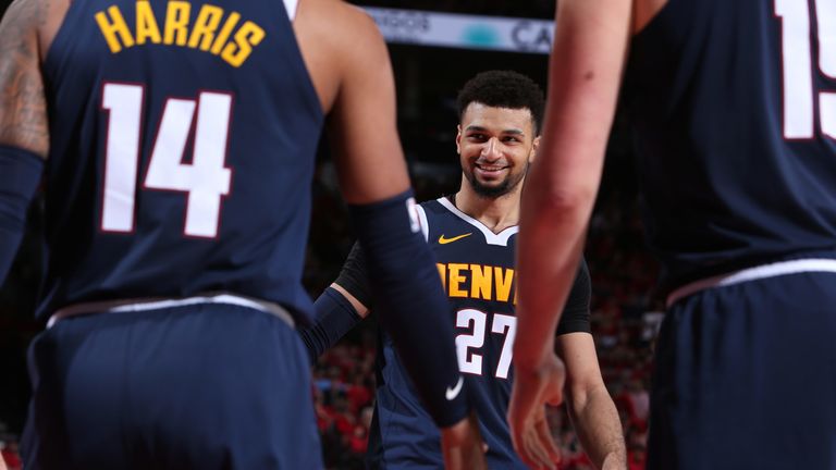 Jamal Murray is congratulated by his team-mates during Denver's Game 4 win