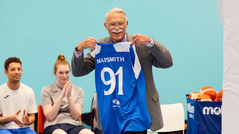 Jim Naismith holds his Scotland Basketball jersey - photo courtesy of Simon Way/NBAE