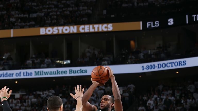Khris Middleton shoots a three-ball in Game 2 against the Celtics