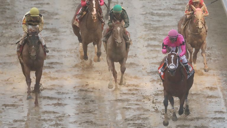 Maximum Security passes the post first in the Kentucky Derby