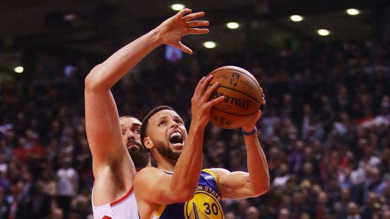 Marc Gasol is right on Stephen Curry's tail as he tries to get a shot away